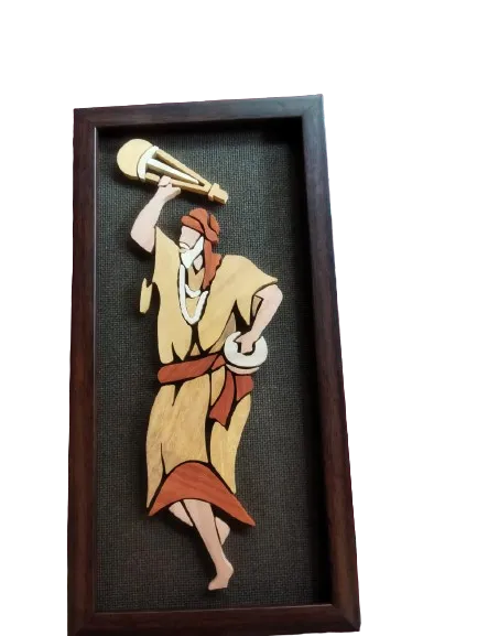 This handcrafted Baul dancing figure wall hanging piece captures the spirit and rhythm of the traditional Baul folk culture, beautifully sculpted from a variety of natural woods. Each piece of wood is carefully sourced from different regions around the world, showcasing a vibrant array of natural colors and textures. The hues you see are entirely authentic, as no artificial paints or dyes have been applied, preserving the wood’s original beauty. The detailed craftsmanship reflects the lively and soulful essence of the Baul dancers, making this figure not just a decorative piece but a celebration of cultural heritage. Perfect for adding a touch of tradition and artistry to any space, this Baul dancing figure brings a sense of movement, music, and natural beauty into your home or office. Celebrate the rich traditions and natural elegance with this exquisite, eco-friendly creation.